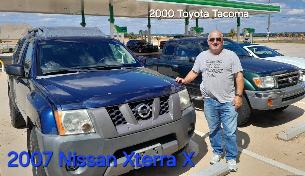 Image of Darrell with his new 07 Xterra X and 00 Tacoma after just purchasing in September 2024